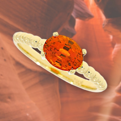 Ring aus reyceltem 585 Gold mit einem orangefarbenen Granat fair gehandelt fair abgebaut der Ring besteht aus kleinen Kügelchen