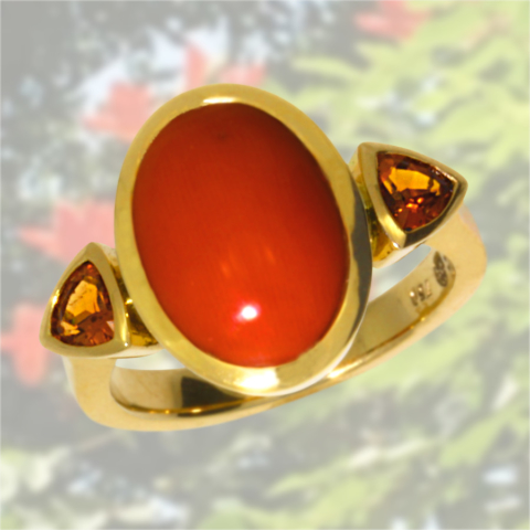 Ring mit Koralle und Mandaringranaten in 750 Gelbgold