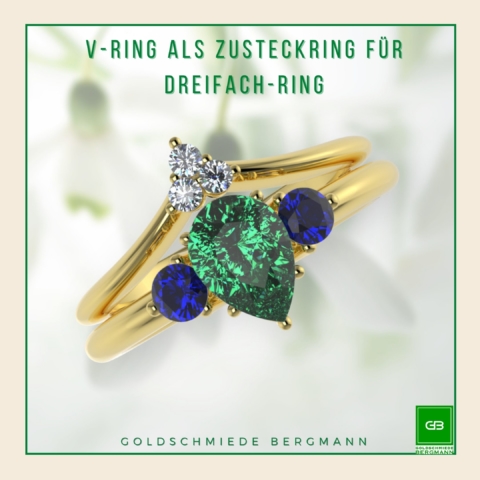 V-Ring als Zusteckring für einen Dreifachring mit Smaragd-Tropfen und runden Saphiren in Gelbgold